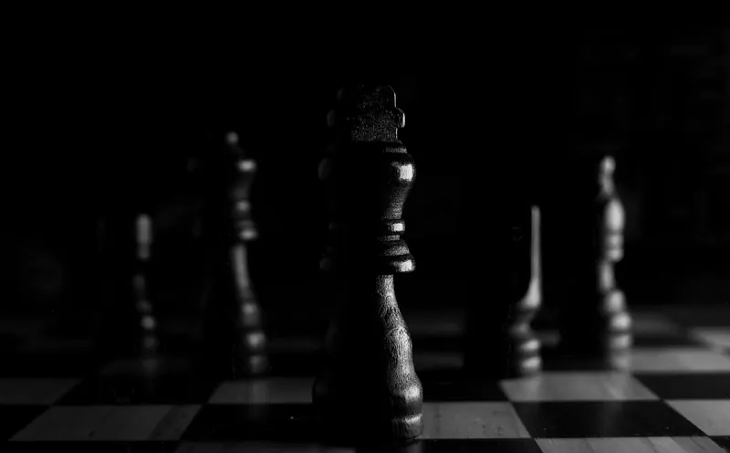 Close-up of chess pieces arranged on a board