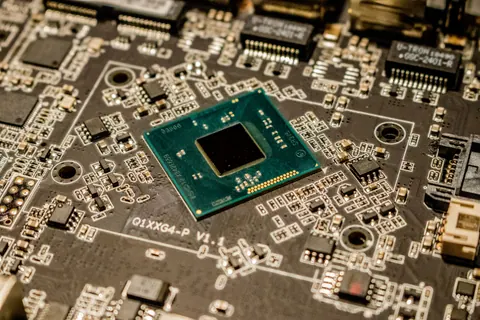 Close view of a microchip and surrounding circuit board