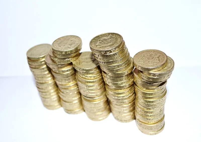 Growing stacks of gold coins