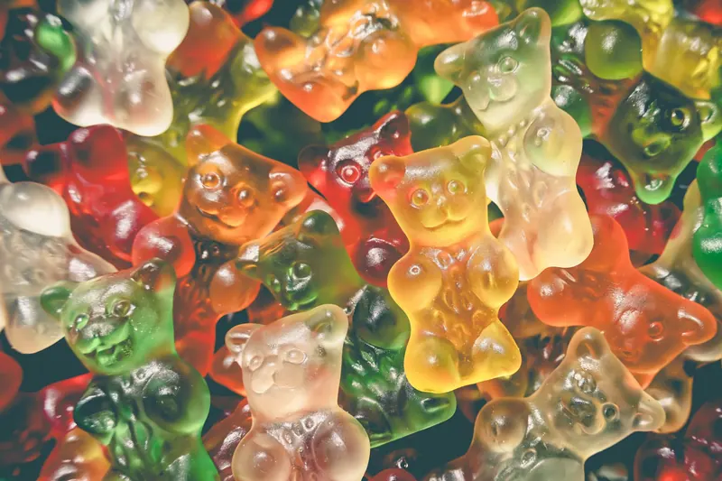 Vibrant and tasty gummy bears, a colorful assortment of sweet candy. Perfect for confectionery and dessert imagery
