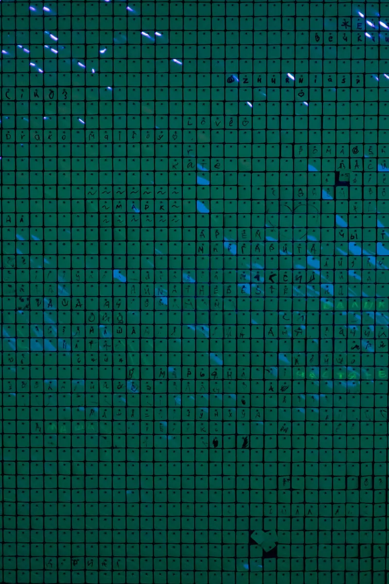 A colorful neon grid pattern glowing in the dark