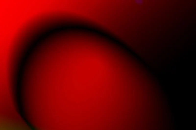 Abstract red and black shapes on a minimal background